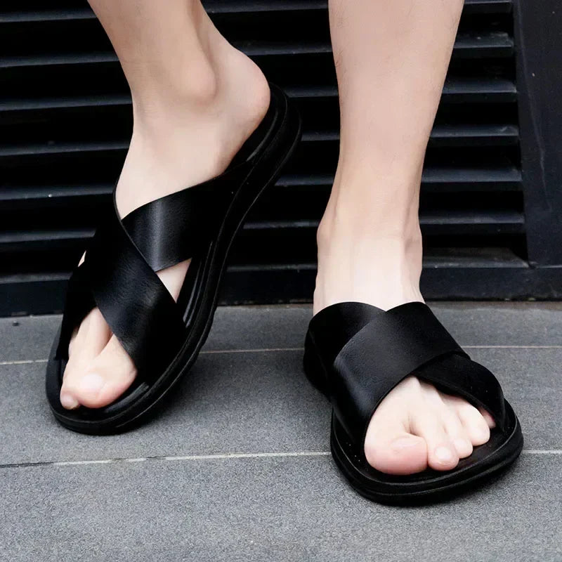 Stylish men's leather slip-on sandals for warm weather. Easy wear summer fashion for casual outfits.