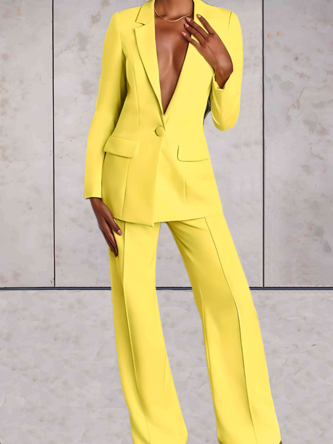 Elegant women's business two-piece set featuring a tailored blazer & wide-leg pants, perfect for professional office wear.