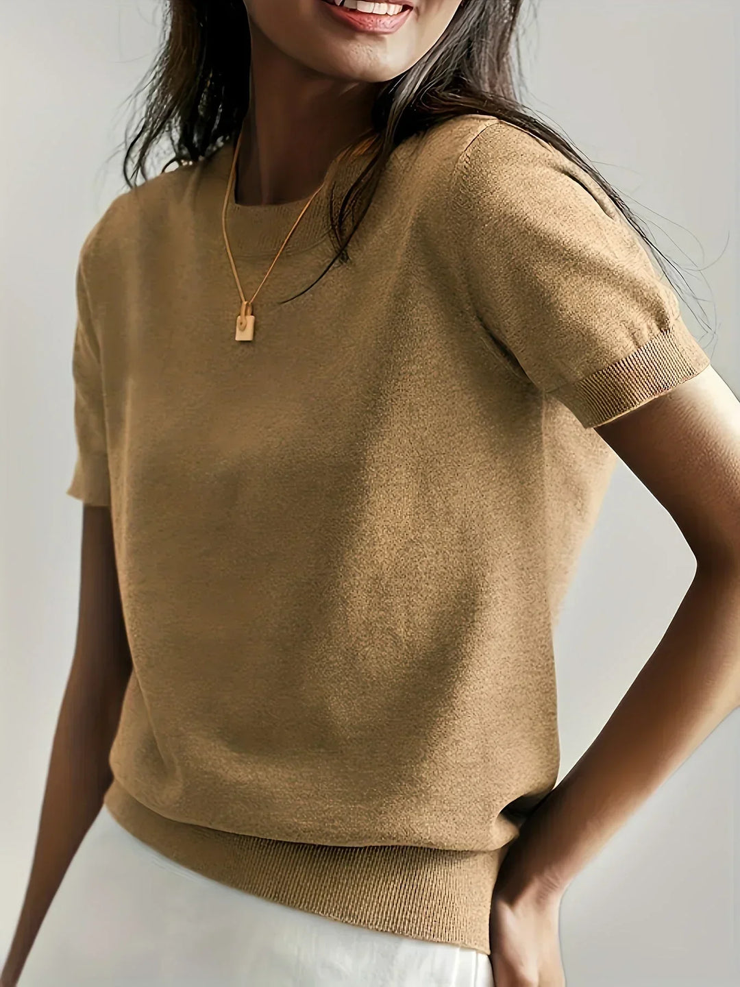Trendy short sleeve spring top, a comfortable knit for versatile ladies' fashion.