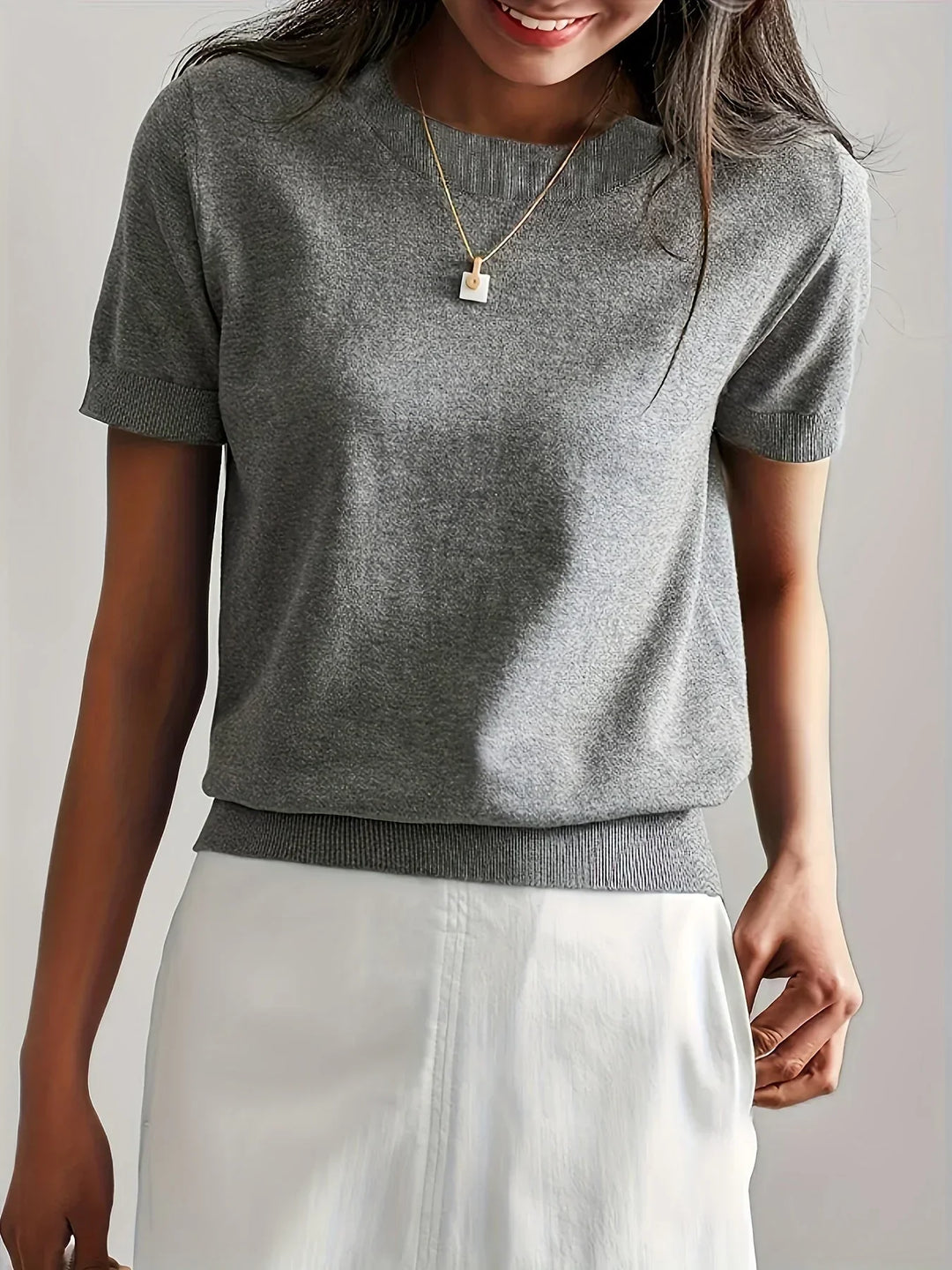 Comfortable ladies knit top, ideal for spring fashion and versatile summer outfits.