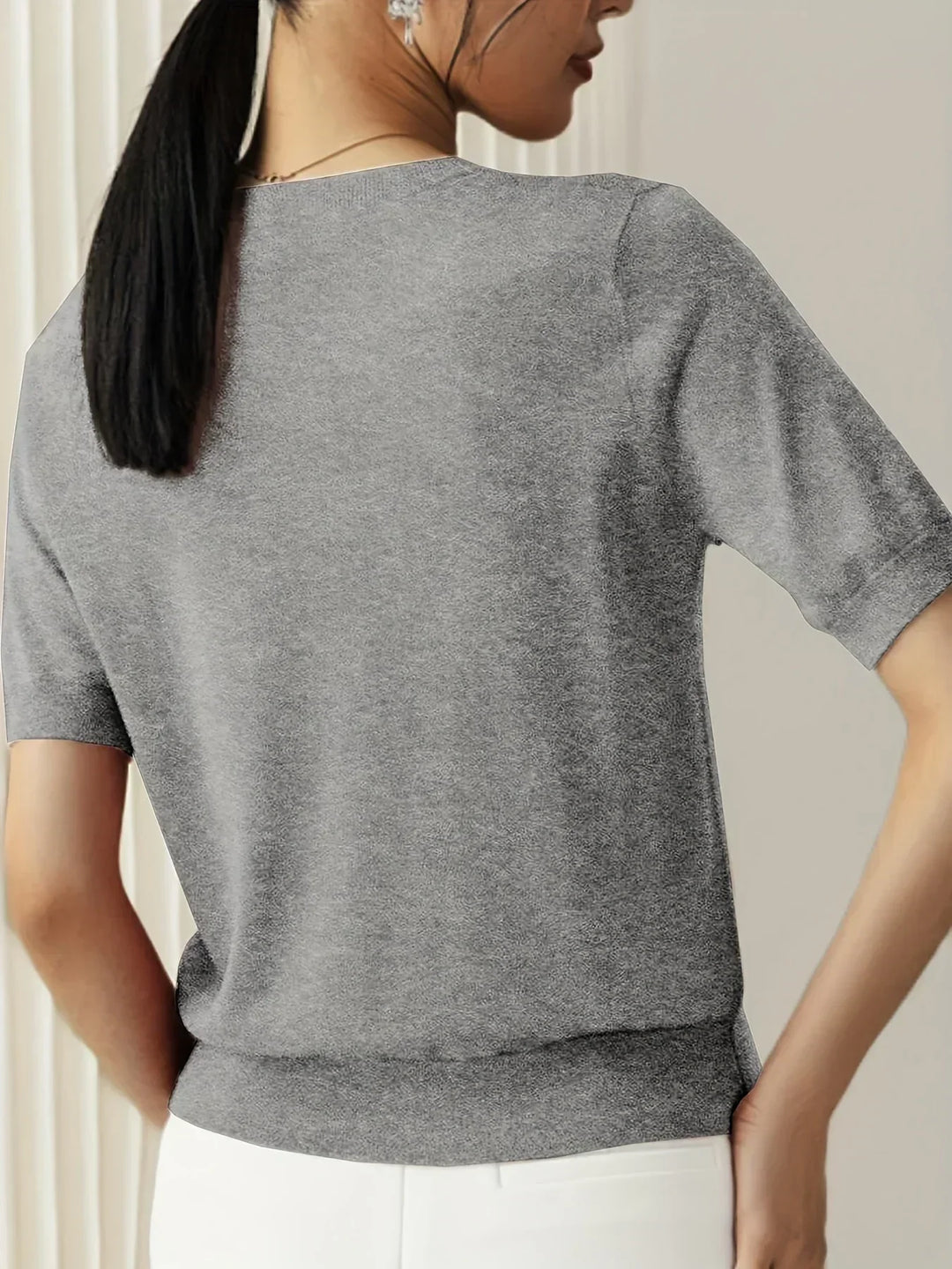 Soft short sleeve sweater for women, a stylish and lightweight spring fashion essential.