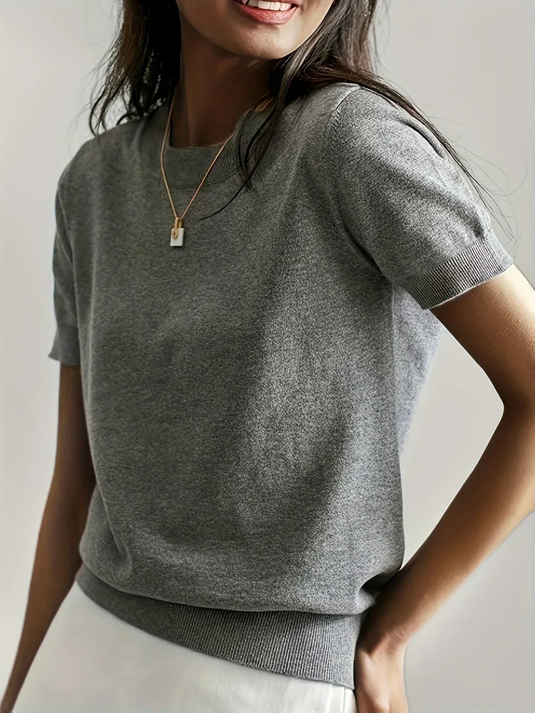 Women's lightweight short sleeve spring sweater, perfect for casual everyday style.