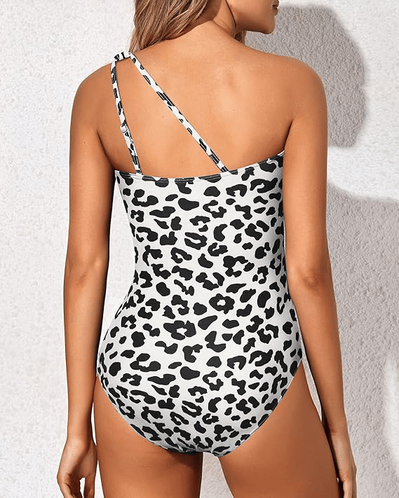 Stylish women's one-shoulder swimwear, offering tummy control for a slimming beach vacation.