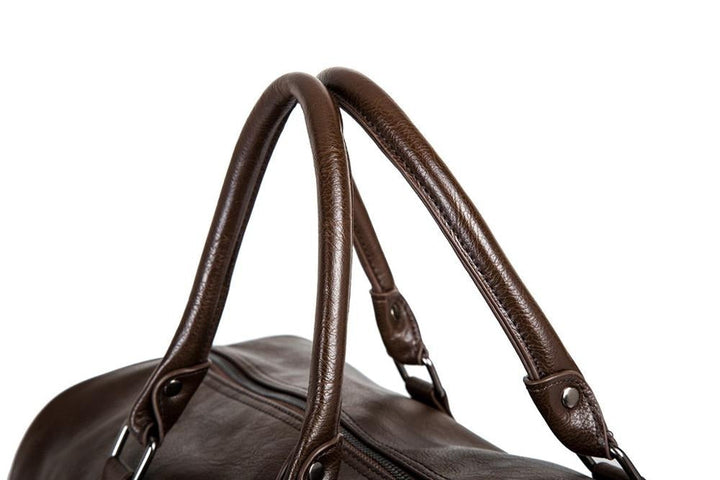 Unisex large travel duffel, faux leather, lightweight black carry-on for efficient packing.