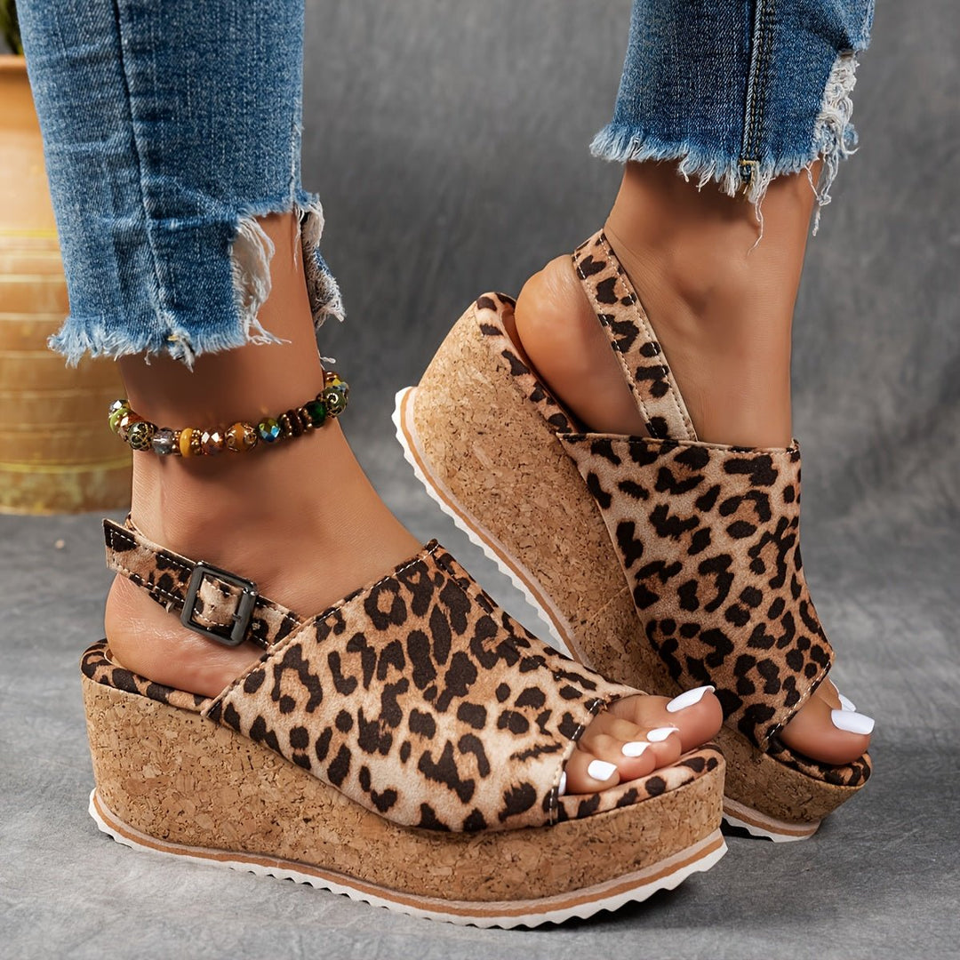 Fashionable leopard print women's platform wedge sandals with adjustable strap, great for casual outfits.