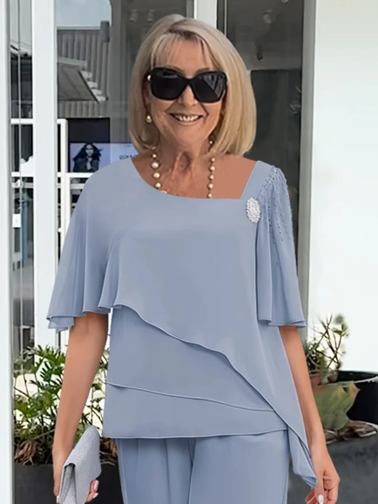 Chic women's matching top and pants set for spring fashion. Comfortable and stylish two-piece outfit for everyday.