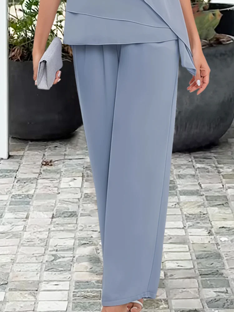 Women's casual chic two-piece top & pants set in light blue or navy. Perfect for comfortable summer style.