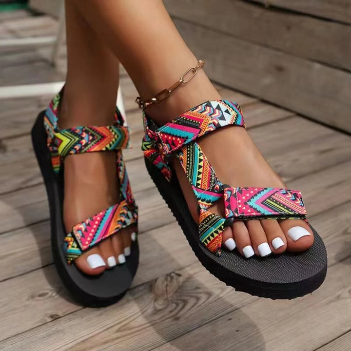 Close-up of comfortable women's summer sandals, showing non-slip sole and colorful, lightweight straps for beach wear.