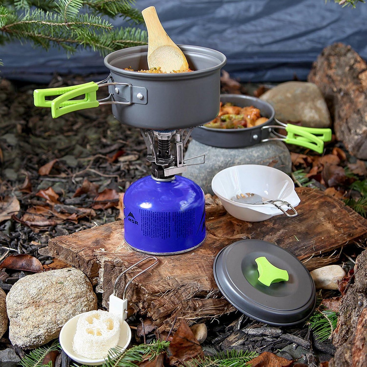 Lightweight camping cookware set for outdoor cooking, includes pot, pan, bowls; anodized aluminum, non-stick, portable.