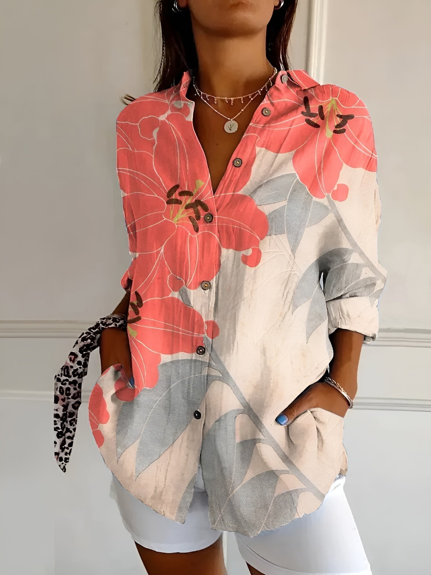 "Lightweight women's button-down summer blouse with classic collar, full-length sleeves, in breathable fabric for sunny days.