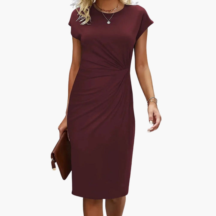 Chic women's short sleeve midi dress, a versatile piece for elegant style, suitable for work or leisure.