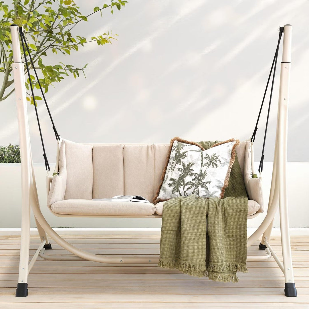 Beige 2-seater outdoor patio swing with soft cushions for comfortable garden relaxation.
