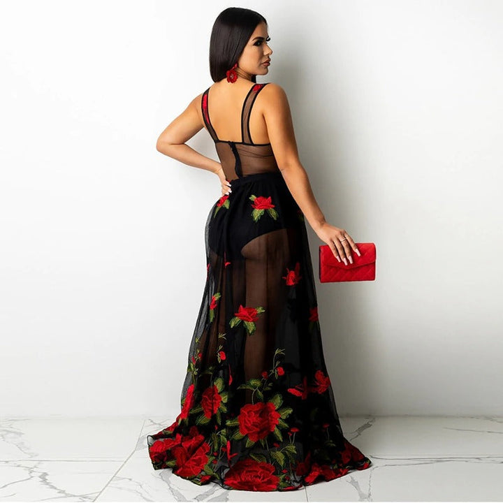 Elegant women's maxi dress with delicate floral embroidery, thin spaghetti straps, and an empire waist.