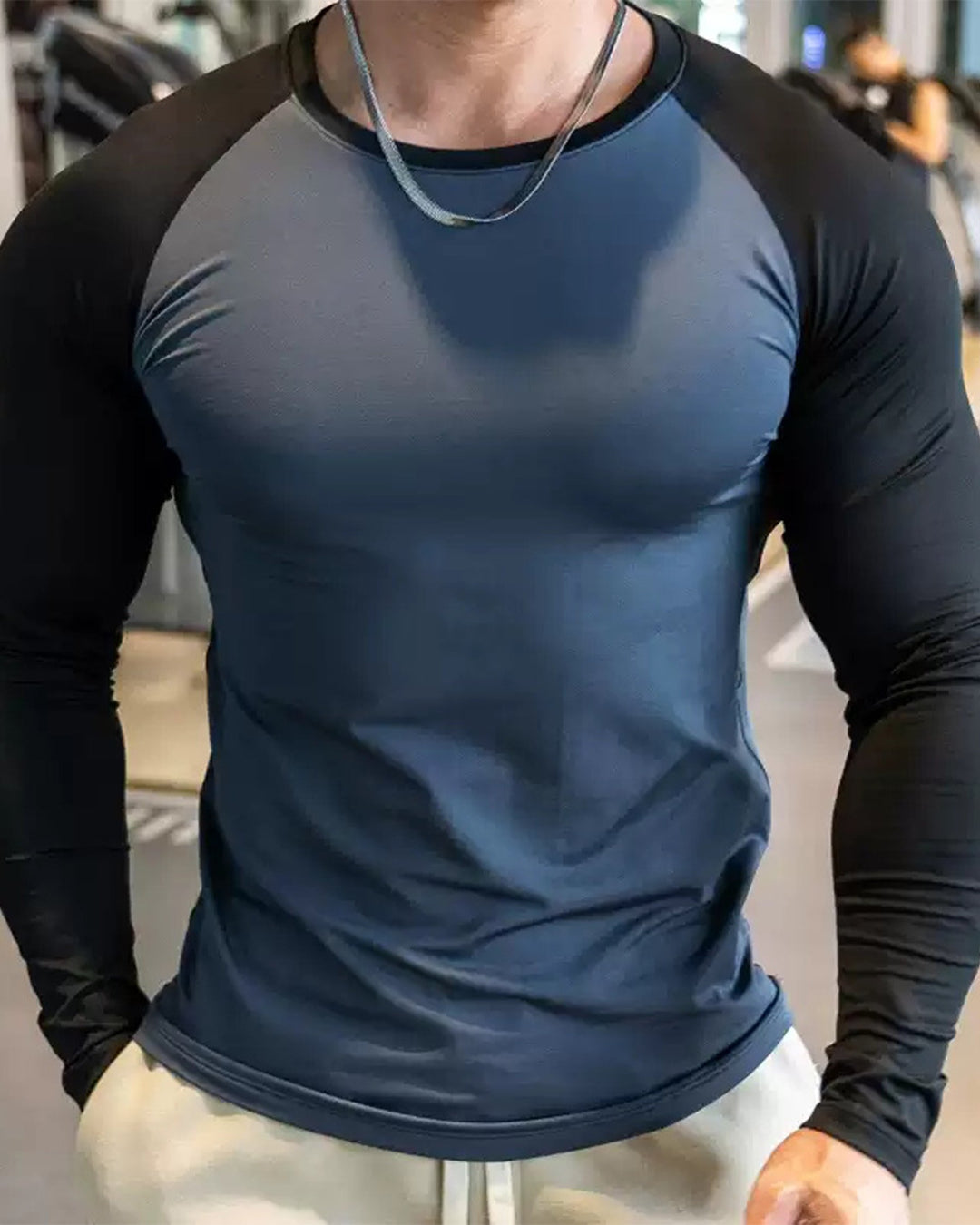 White men's athletic long sleeve shirt, shoulder cut, ultimate performance and flexibility