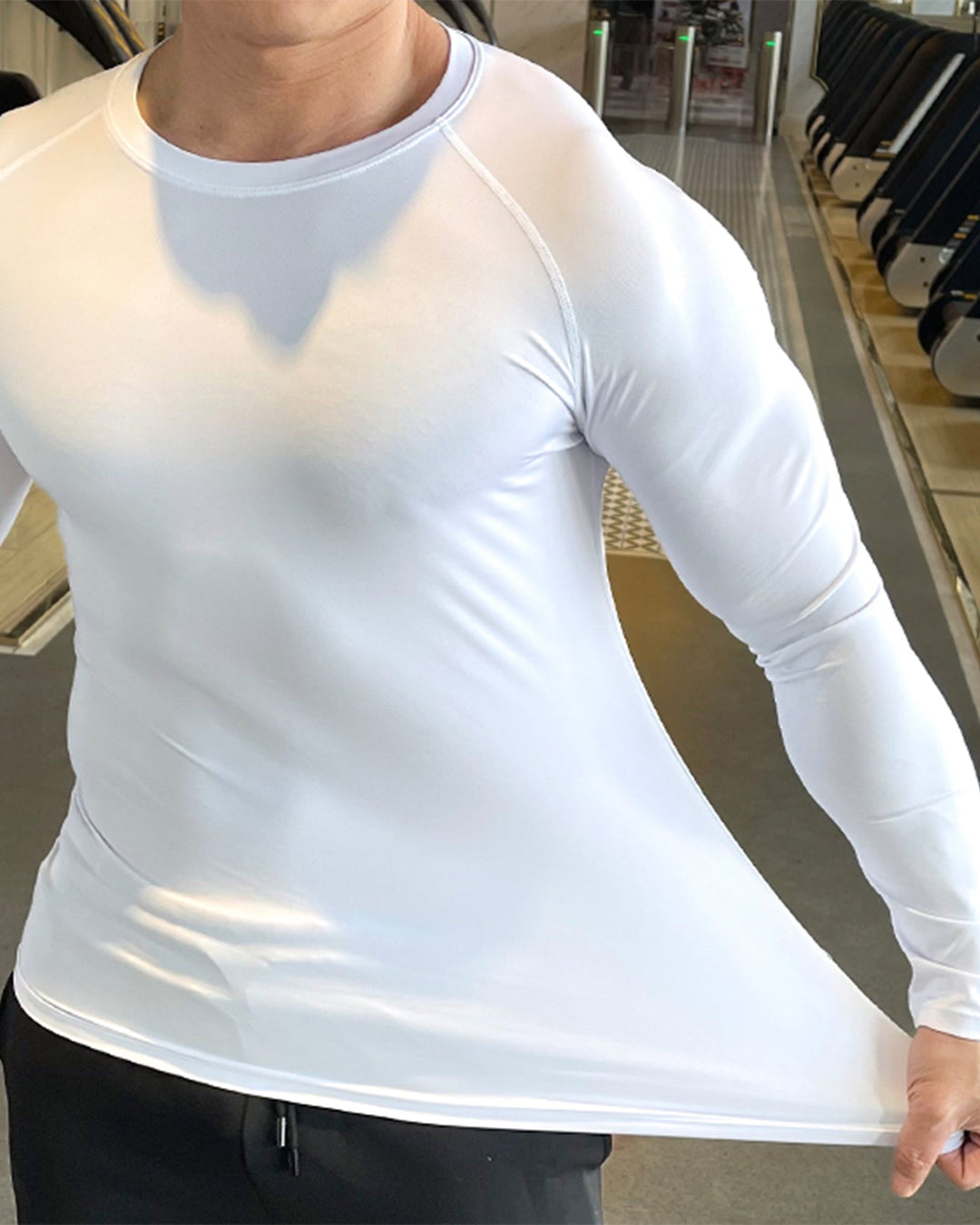 Men's long sleeve performance top, athletic and durable for rigorous gym sessions