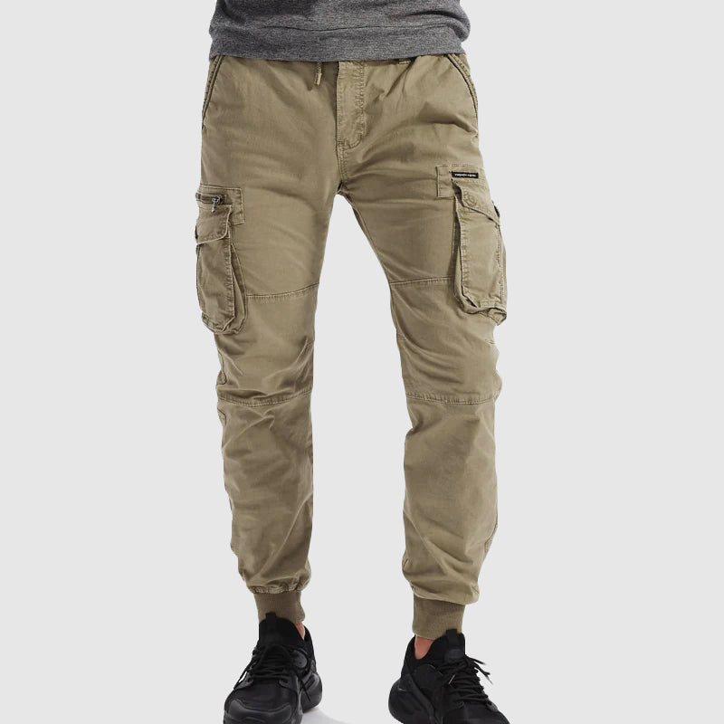 Men's black cargo jogger pants with elastic cuffs, drawstring waist, and utility pockets, ideal for activewear.