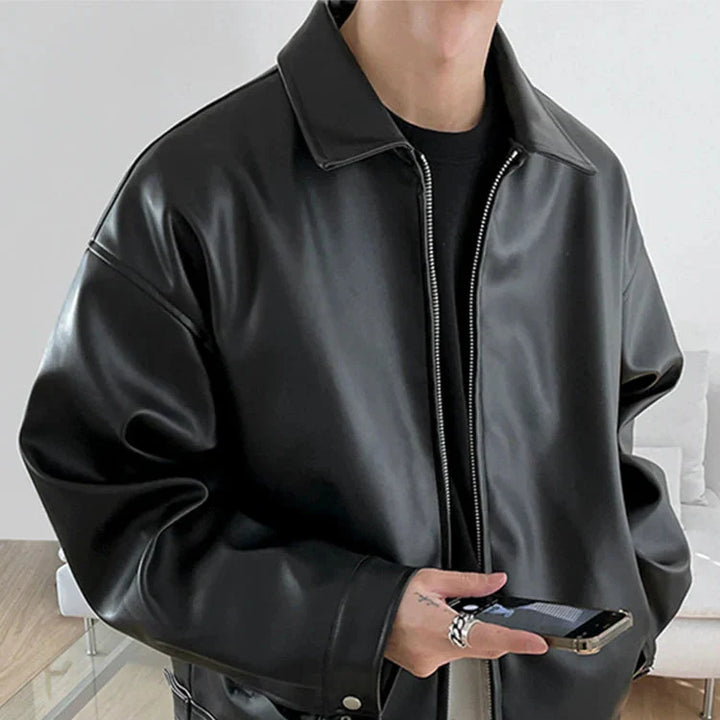 Close-up of the textured faux leather on a men's bomber jacket, black, suitable for men's fashion