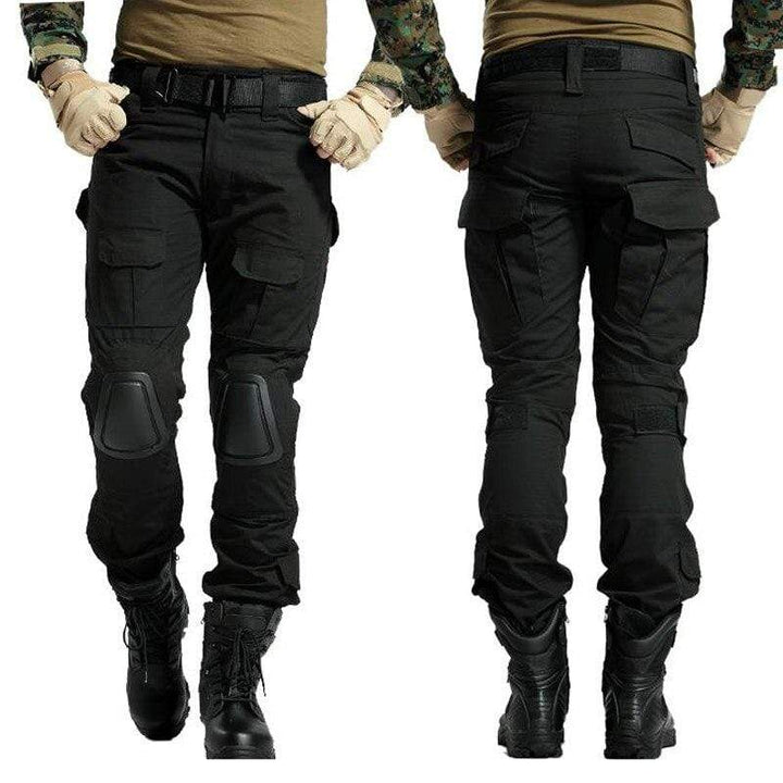 Man wearing gray tactical cargo pants, hiking in an outdoor adventure setting, durable & waterproof