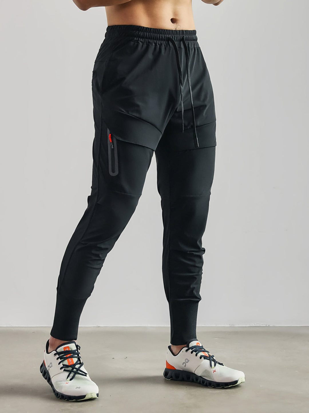 Dark blue men's performance cargo joggers, perfect for workouts or relaxed outings, with a modern tapered leg.