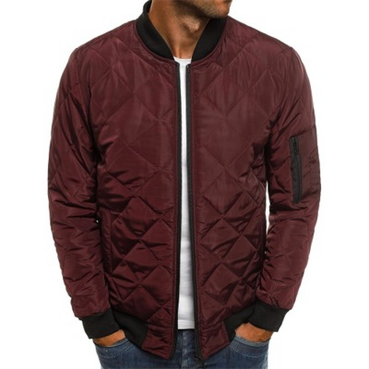 Close-up of a men's black quilted jacket texture, highlighting lightweight design and urban fashion details