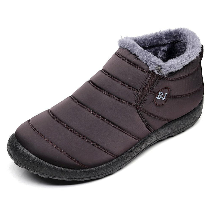 Top-down view of men's brown waterproof snow boots, highlighting the warm fur lining and secure lacing system.
