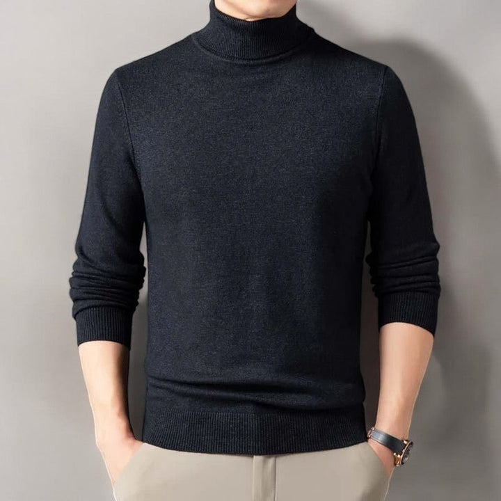 Detailed texture of a men's cashmere blend turtleneck sweater, emphasizing its softness and premium knitwear.