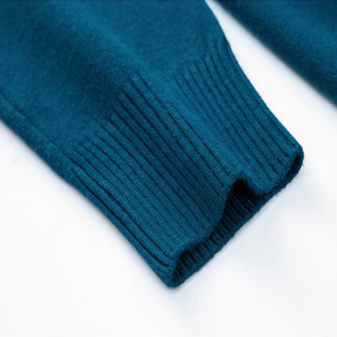Folded men's cashmere blend turtleneck sweater, ready for a cozy winter outfit; a versatile long sleeve top.