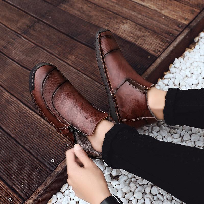 Men's casual shoes: Handcrafted Leather Ankle Boots on a neutral background