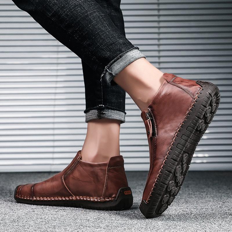 Textured surface of Men's Handcrafted Leather Ankle Boots, rich and durable