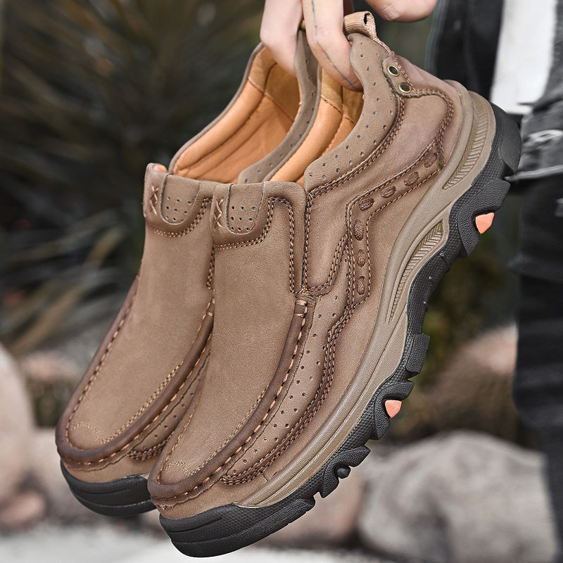 Black casual slip-on shoes for men, made of leather, offering orthopedic support for comfortable walking.