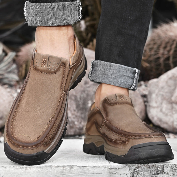 Orthopedic men's brown leather slip-ons, providing excellent posture support and comfort for casual wear.