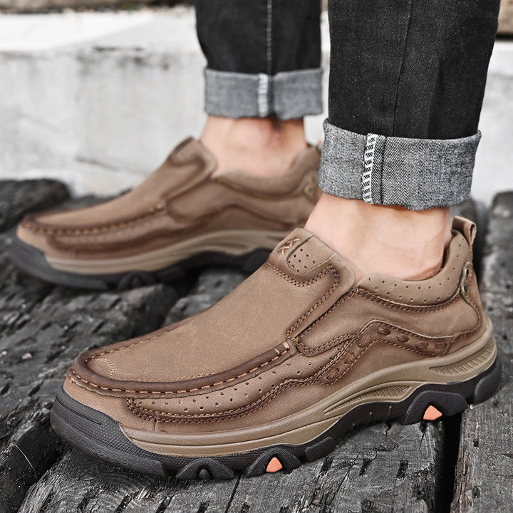 Comfortable casual black slip-on shoes for men, with orthopedic design for walking and daily use.