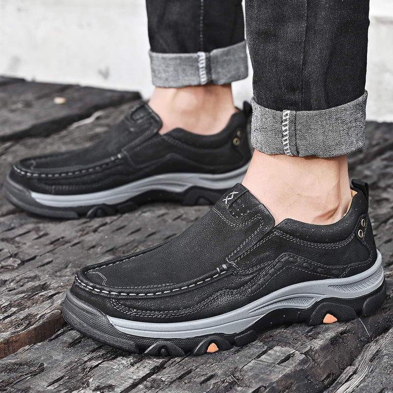 Black leather casual slip-on shoes for men, featuring orthopedic technology for comfortable walking.