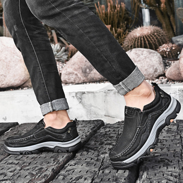 Casual black leather men's slip-on shoes, designed for orthopedic comfort and long-lasting walking pleasure.