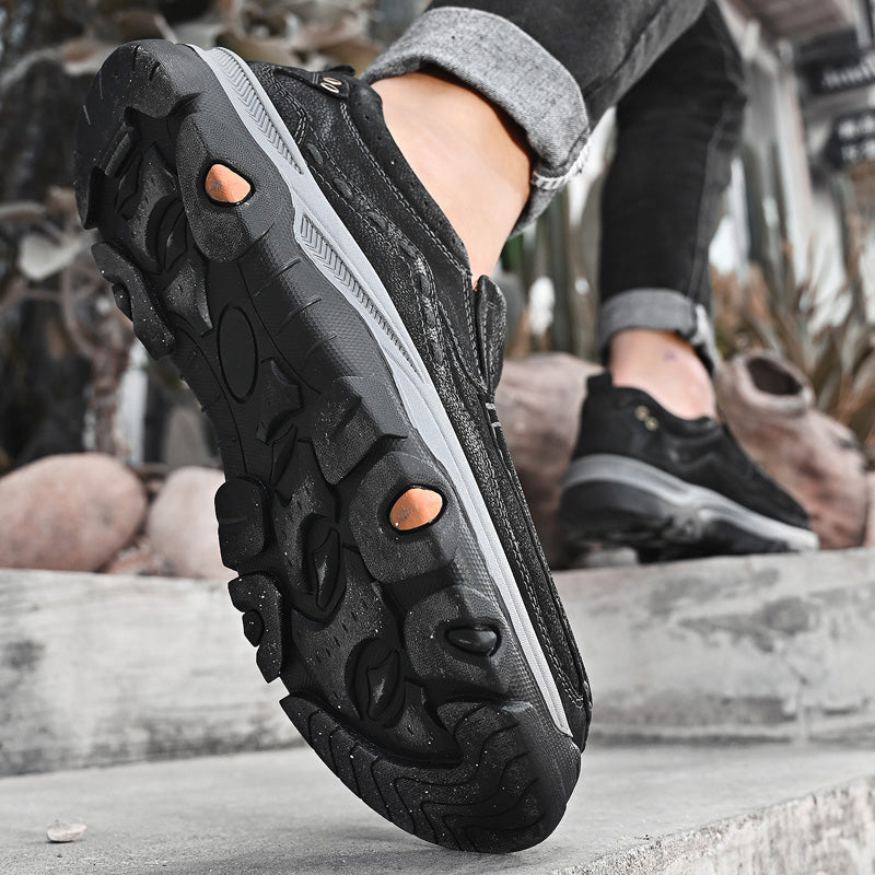 Black leather casual slip-on orthopedic shoes for men, ensuring comfortable walking and all-day support.