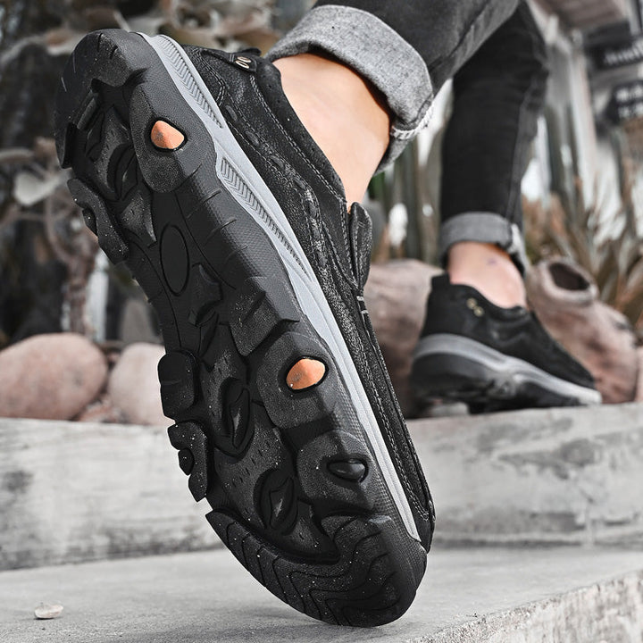Black leather casual slip-on orthopedic shoes for men, ensuring comfortable walking and all-day support.