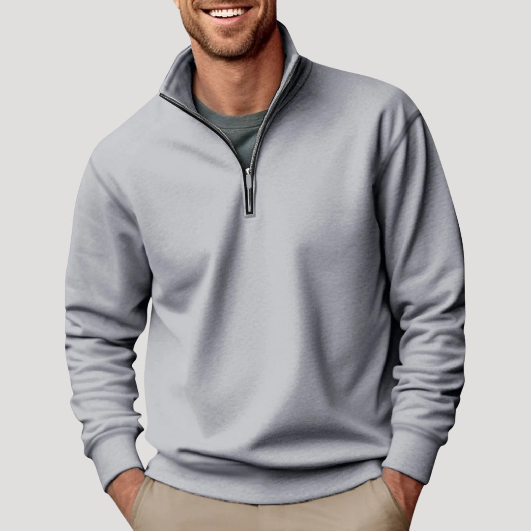 Stylish quarter-zip men's sweatshirt in an autumn setting, comfortable long sleeve