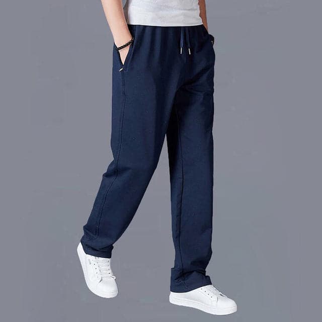 A man wearing stylish relaxed fit spring pants, demonstrating their comfortable and versatile look.