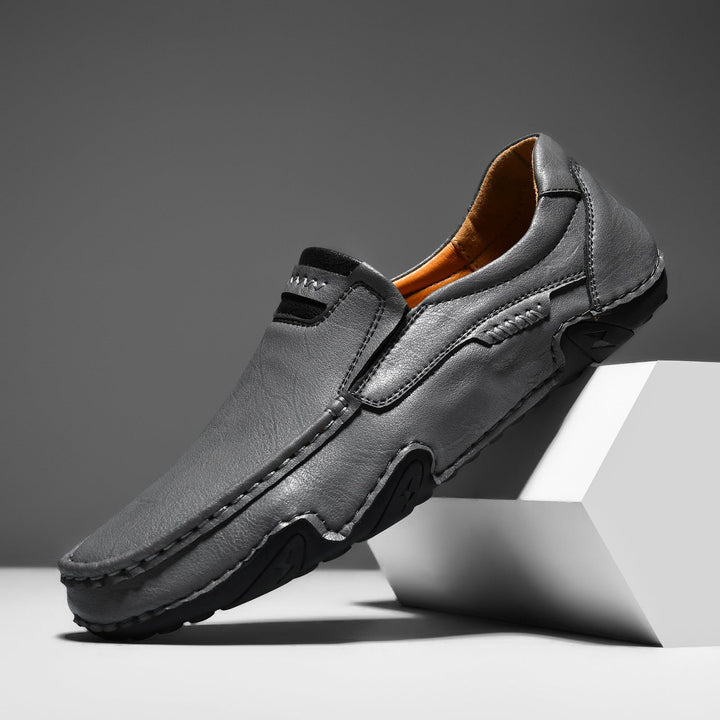 Men's slip-on driving shoes made of soft faux leather, offering both grip and comfort