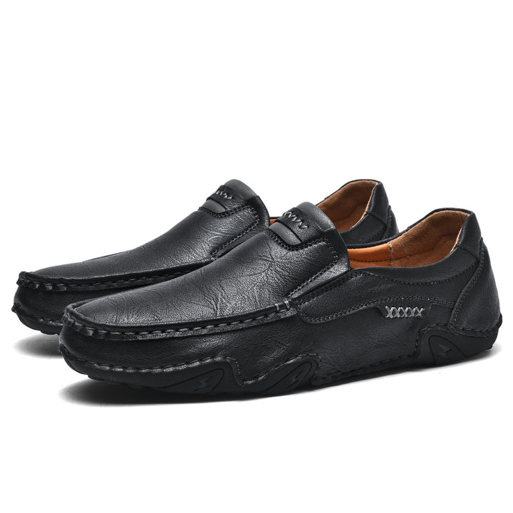 Close-up of the textured faux leather on men's casual slip-on loafers, highlighting quality