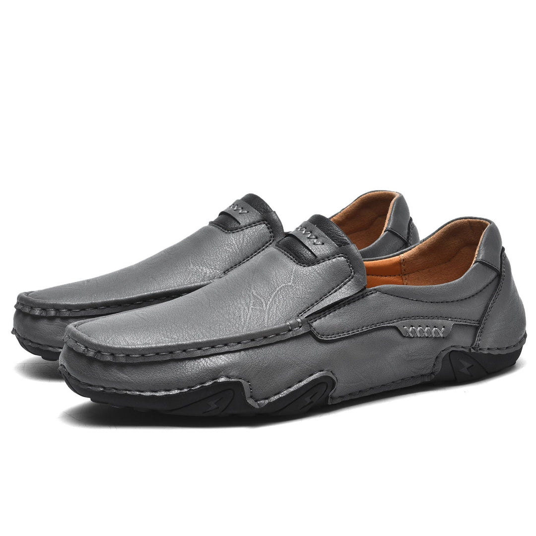 Pair of men's faux leather slip-on loafers, versatile for both casual outings and formal events