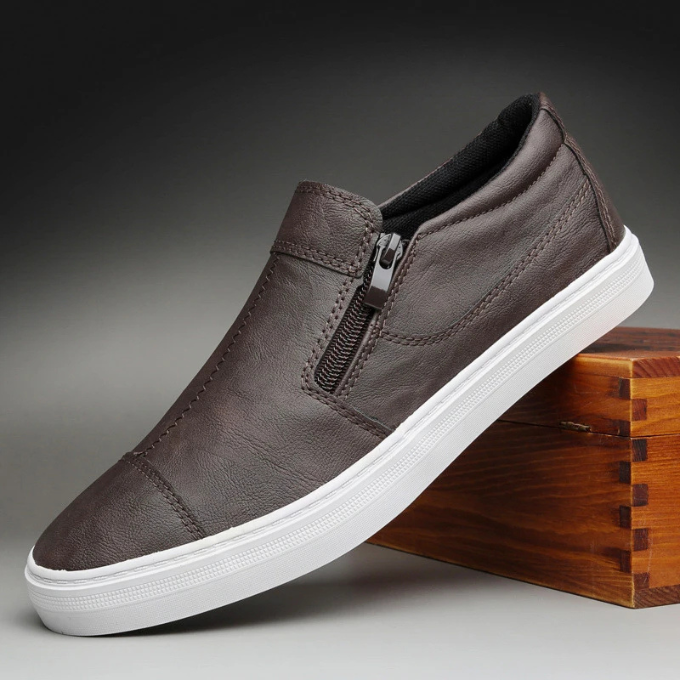 Black leather-look men's casual shoes, designed with a practical zip closure for convenience