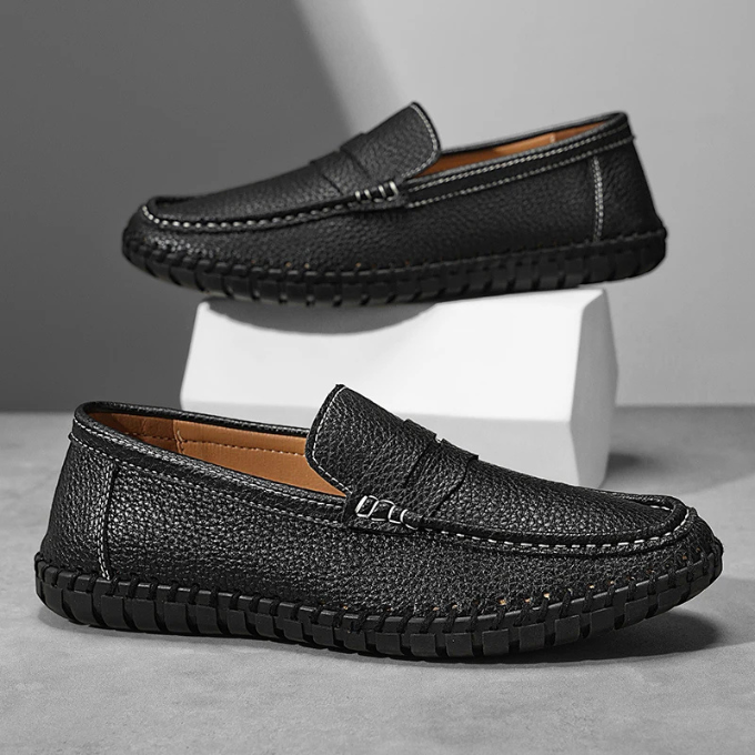 Detail of durable rubber sole on men's full-grain leather casual dress loafers