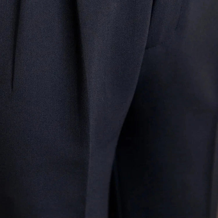 Men's straight leg dress pants in a casual office environment, showcasing business casual versatility