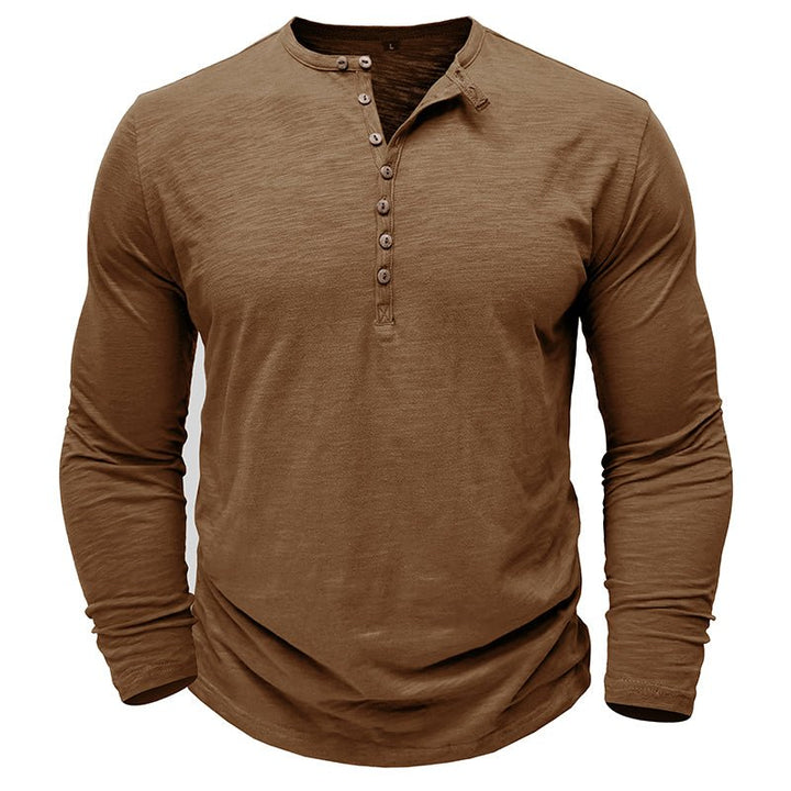 Men's long-sleeve henley shirt folded neatly, emphasizing its casual elegance and comfortable fabric