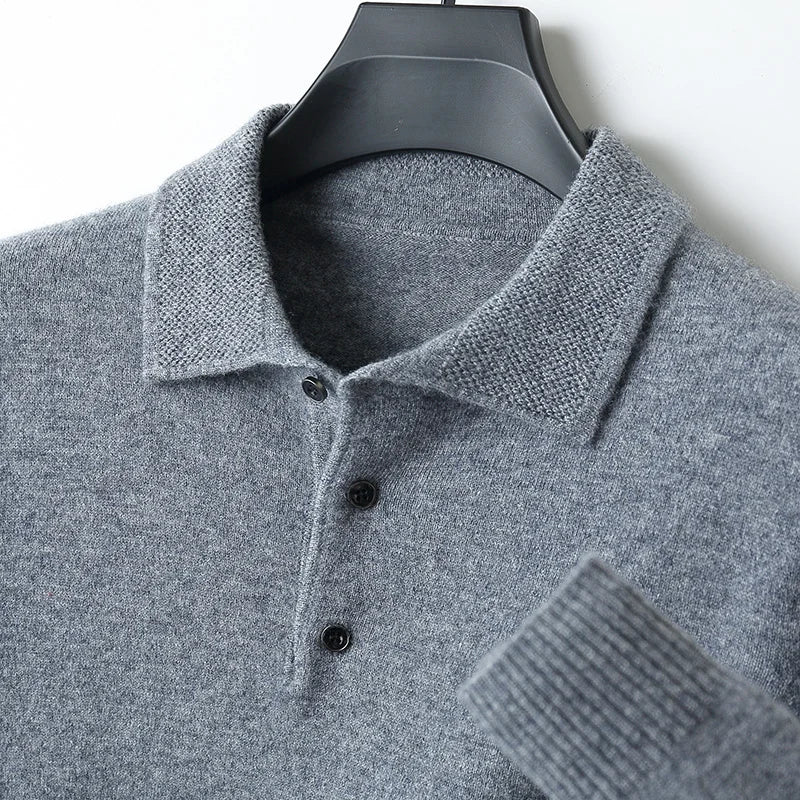 Close-up of a men's knit merino wool cardigan, showing the soft texture and button details.