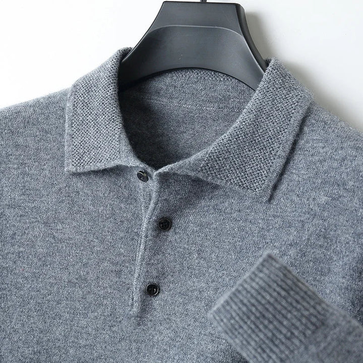 Close-up of a men's knit merino wool cardigan, showing the soft texture and button details.