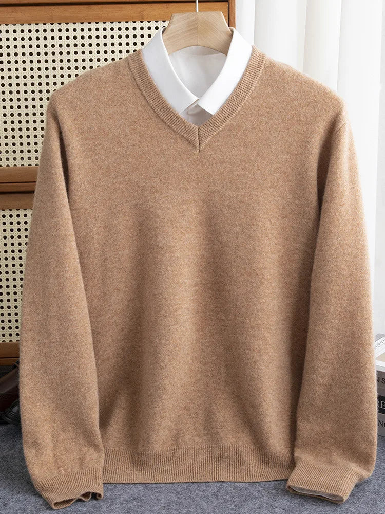 Red men's merino wool V-neck sweater on a hanger, showcasing its elegant drape and knitwear quality