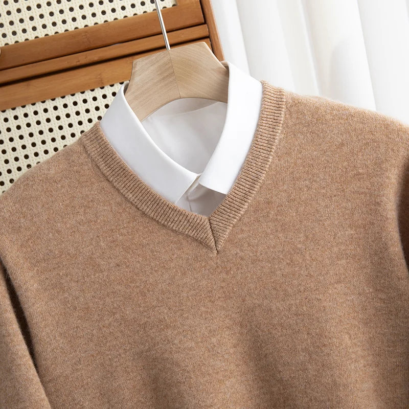 Green men's V-neck sweater made of merino wool, offering breathable comfort and classic winter fashion