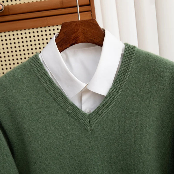 Folded green men's merino wool V-neck sweater, highlighting its soft, breathable knitwear for comfort